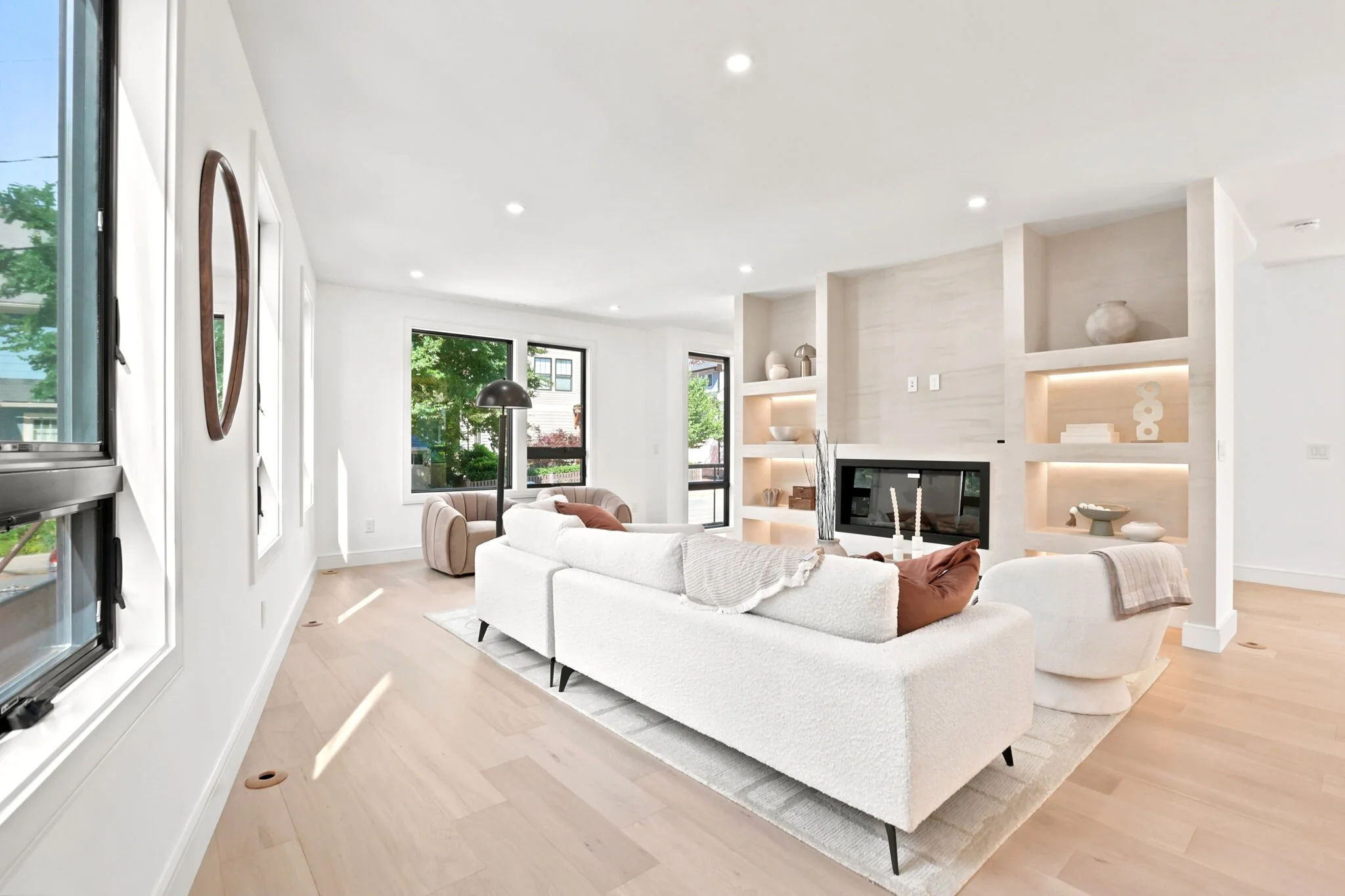Living room with custom built-ins and a linear fireplace